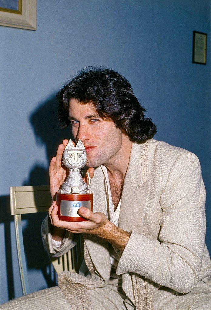 John Travolta kissing the Telegatto award, 1978