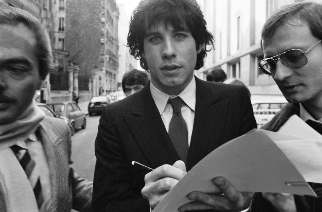 John Travolta giving autograph, 1980