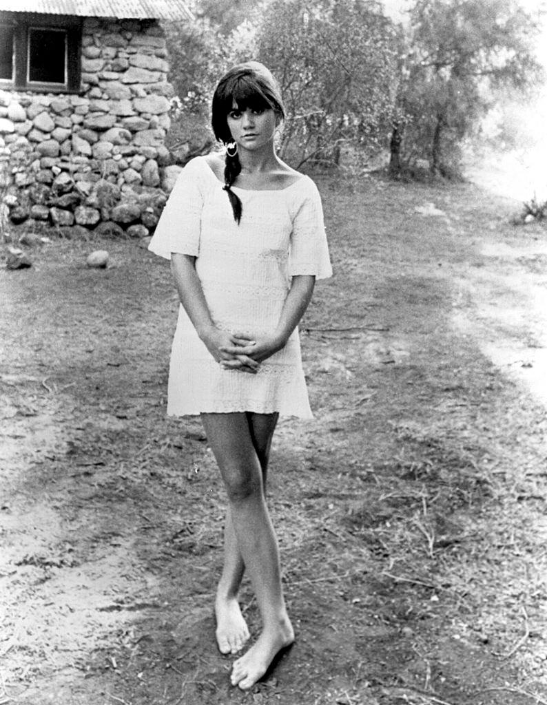 Young Linda Ronstadt in a village, 1970