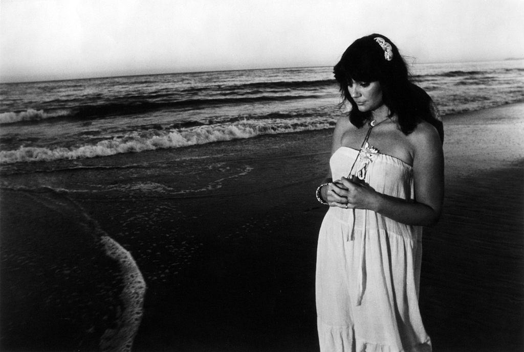 Linda Ronstadt on a beach, 1970