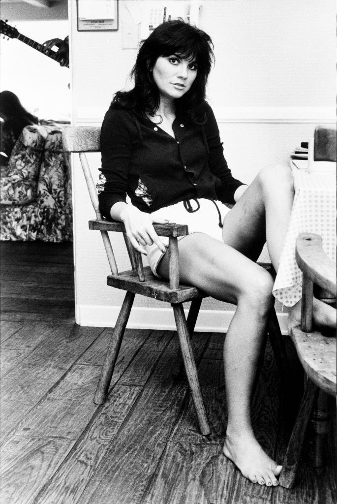 Linda Ronstadt relaxing on a chair, Los Angeles, California, 1977