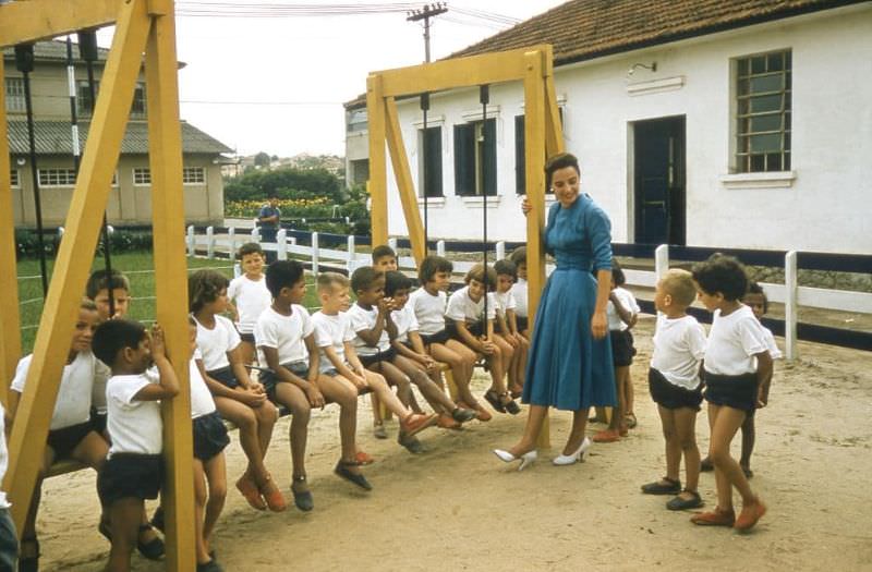 Nelita Pignatari with children from company school Francisco Pignatari's Rolling Mill in Sao Paulo.