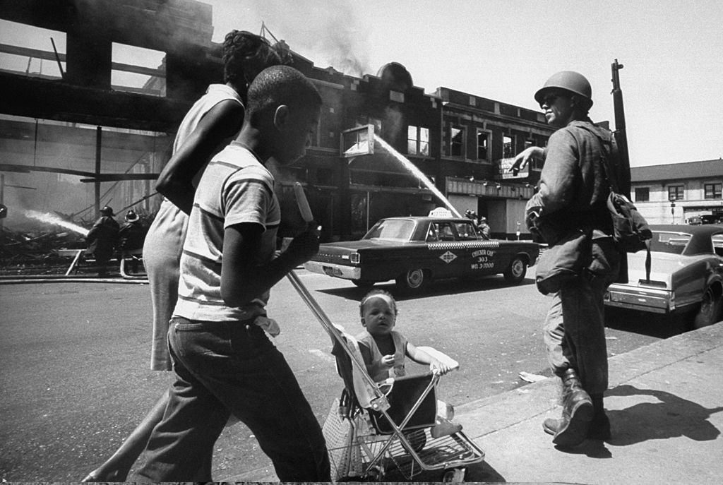 Aftermath of Detroit race riots, National Guard patroling streets, 1967