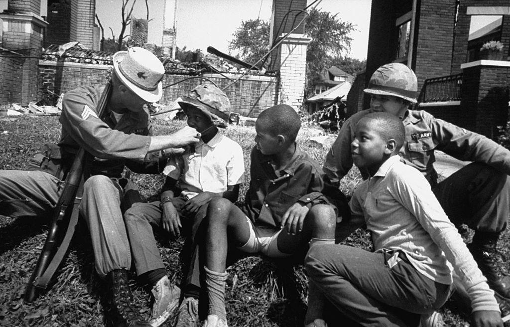 Aftermath of Detroit race riots, National Guard having good time with kids, 1967