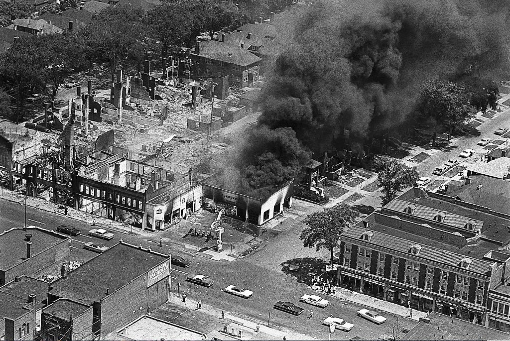 The gutted remins of buildings (left) attest to the destruction caused by two days of rioting in Detroit's west side, 1967