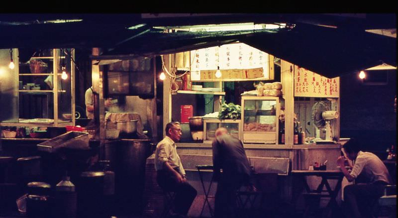 People at a night restaurant, Hong Kong, 1970s