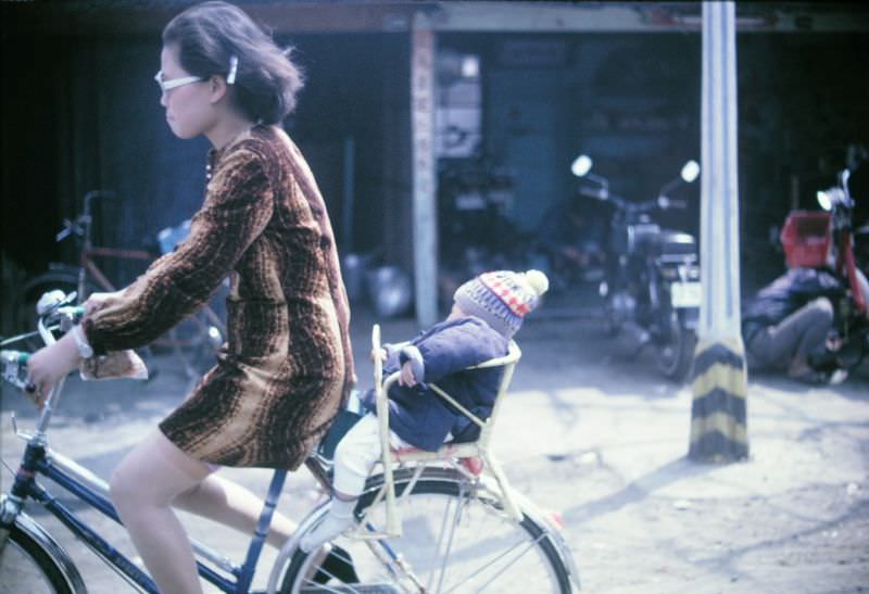 Mother with son on bicycle, Taiwan, 1970s