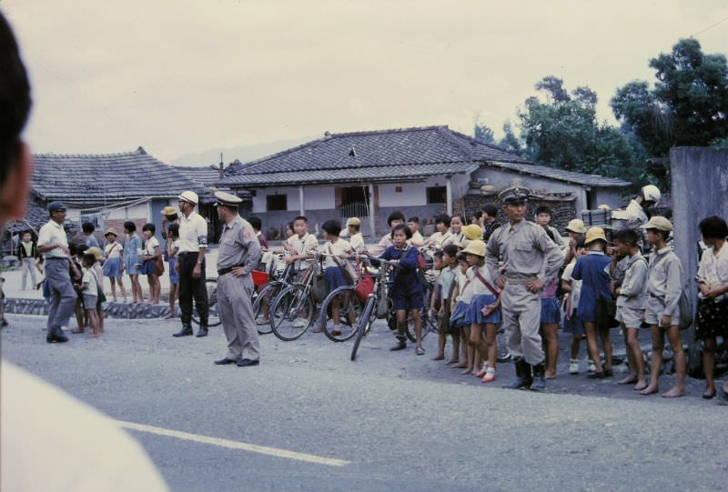 Stopped for an air raid alert in a small village, Taichung, 1970s
