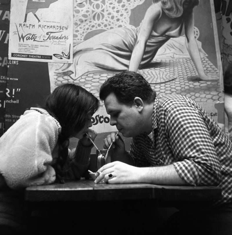A couple share a soda at the Cock N' Bull on Bleecker Street in 1959.