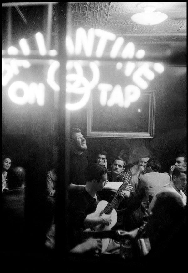 Hugh Nanton Romney sings at McSorley's saloon in 1959. Later, Romney would adopt the name "Wavy Gravy" and become a lifelong peace activist.