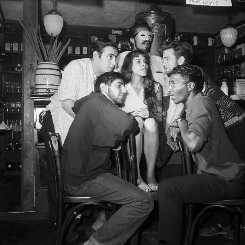 The winner of "Miss Beatnik," identified only as "Angel," is surrounded by the judges of the contest.