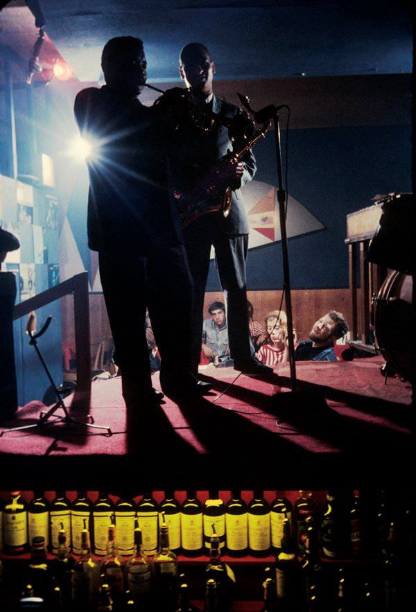 A jazz bands plays from the top of a liquor cabinet at the Half Note nightclub, a regular hangout for the New York Beats, in 1959.