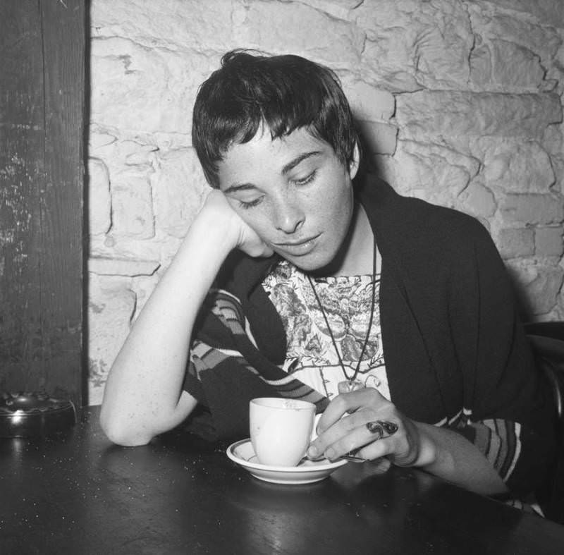 A woman sits in contemplation while enjoying an espresso at Gaslight Cafe in 1959.