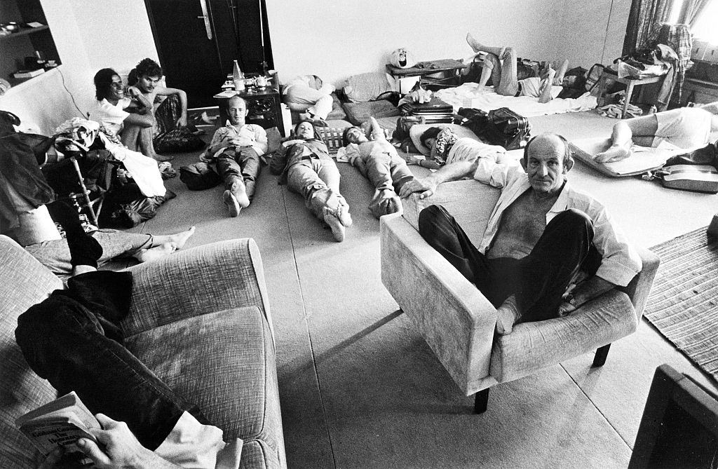 People who found shelter at the French Embassy in Phnom Penh rest in one of the room of the building late April 1975