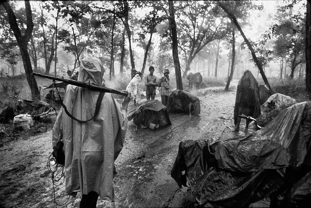 Cambodian refugees and pro Sihanouk guerrilla along the Thai border during the rainy season before the Thai authorities and the UN could get the setup of camps to shelter them.