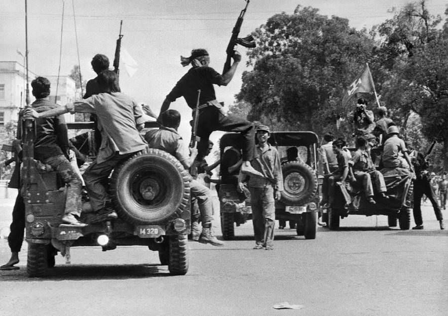 Khmer Rouge soldiers drive through the capital, Phnom Penh. 1975.