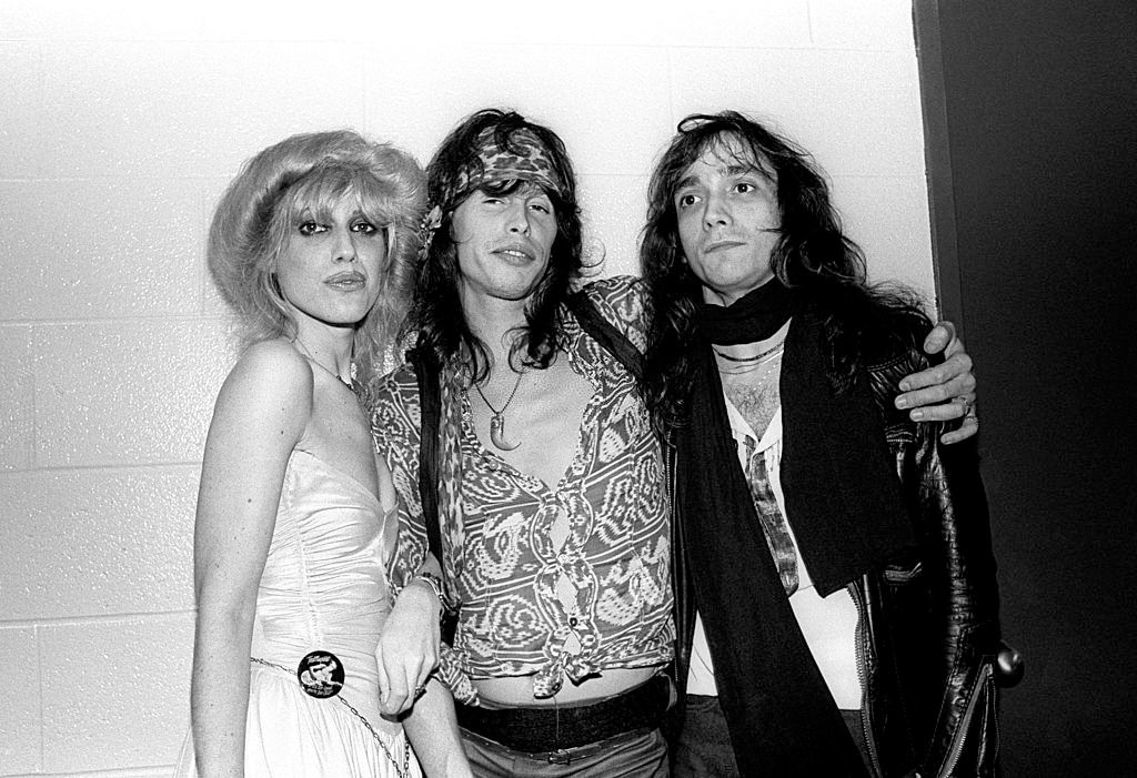 Cyrinda Foxe with Jimmy Crespo and Steven Tyler at a Ted Nugent concert at the Meadowlands Arena in East Rutherford, 1981