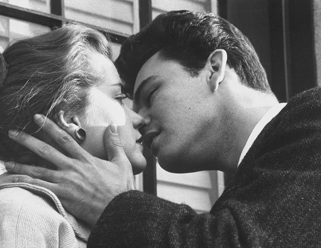 Singer Rod Lauren kissing Delores Hart during screen test, 1960
