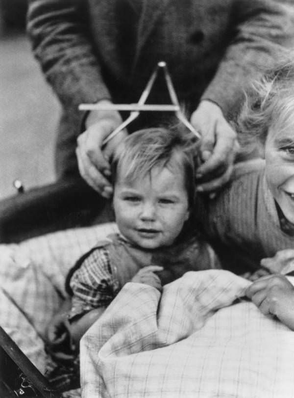 A child's head is measured to determine his personality and predict his future in Schleswig-Holstein, Germany, in 1932.