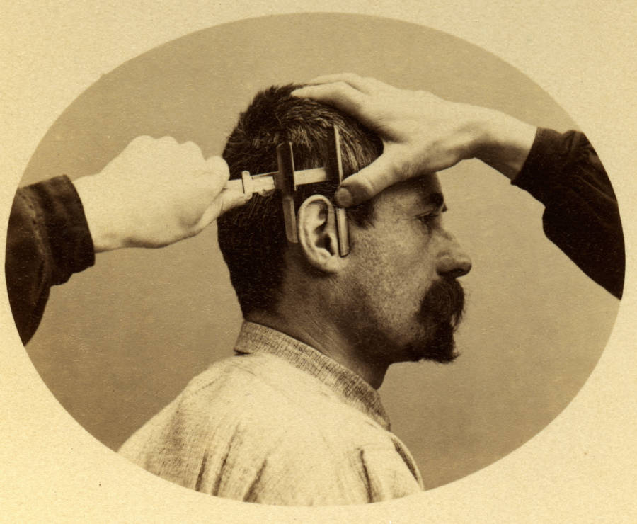 A demonstration of how to measure a criminal's ear, Paris, 1894