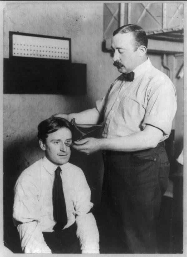 The New York City Police Department demonstrates how to measure a criminal's cranium, 1908