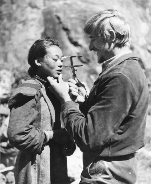 German Dr. Bruno Beger measures a Tibetan woman's head to demonstrate the ("inferior") characteristics of her race.
