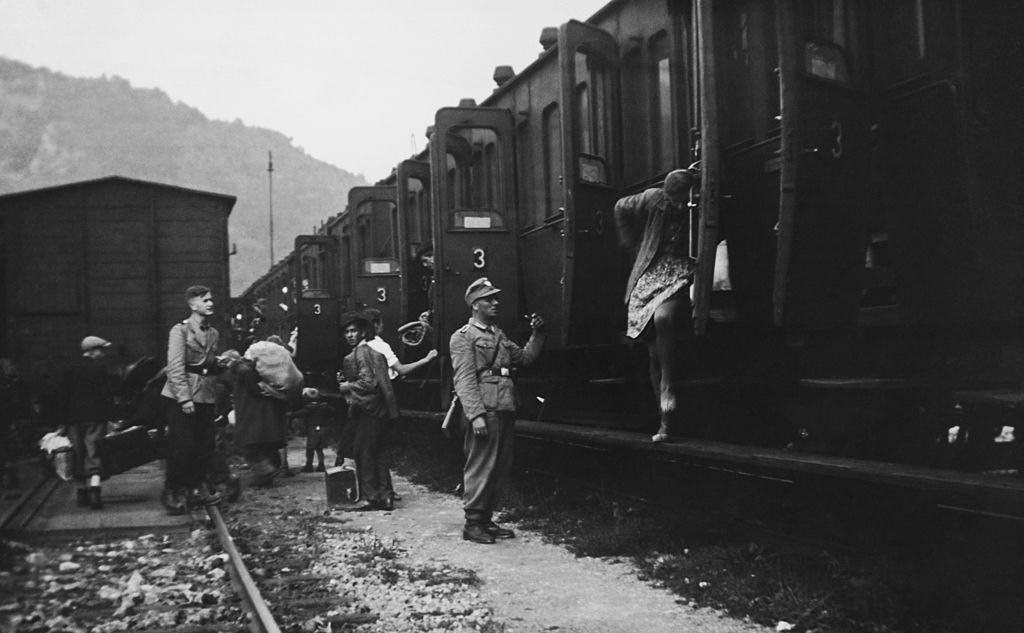 The children of partisan parents from Celje, Yugoslavia (now in Slovenia), arrive in Frohnleiten, Austria, where they are met by German military police officers, August 1942.