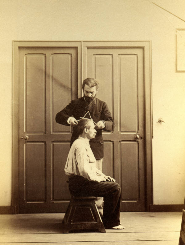 French researcher Alphonse Bertillon demonstrates how to measure a human skull, Paris, 1894