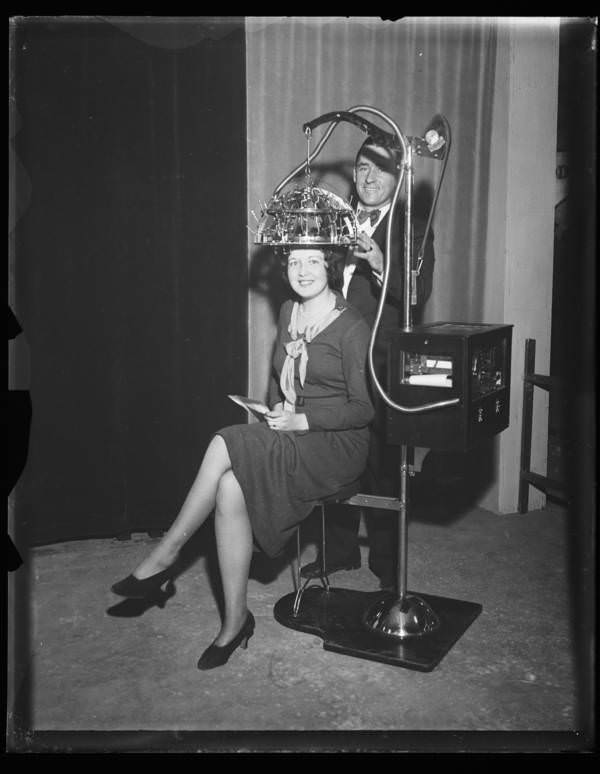 A woman wearing a psychograph, a machine designed to determine someone's mental faculties by measuring their skull, America, 1931