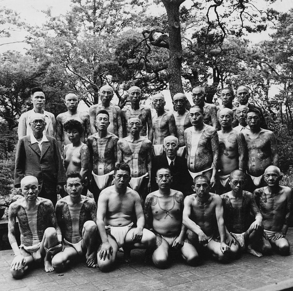 nese gamblers showing their traditional tattoos which reach from shoulder to foot, 1940s