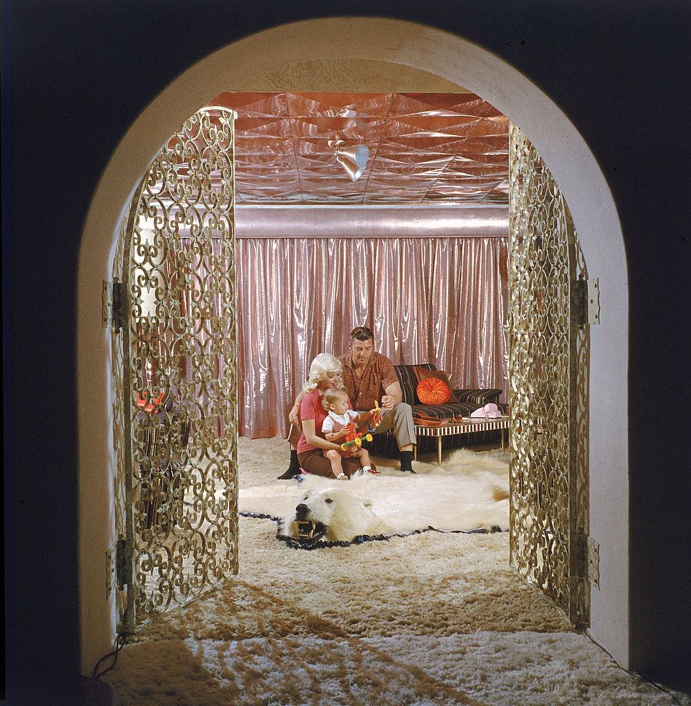 Jayne Mansfield with her son Miklos Hargitay Jr, and husband, Mickey Hargity in their pink palace, 1960s