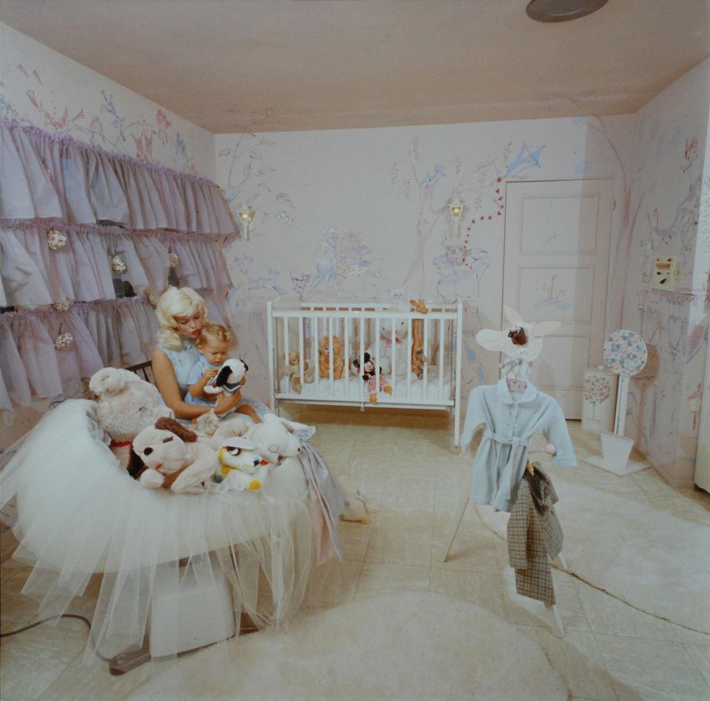 Jayne Mansfield with her son Miklos Hargitay Jr. in the nursery of their lavishly decorated, Pink Palace, 1960s