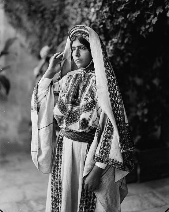 A Ramallah woman in an embroidered dress.Ramallah, Circa 1940-1946.