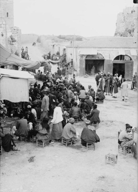 A coffee house spills out onto the streets, Circa 1900-1920