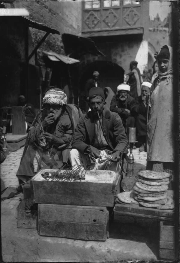 A vendor sells meat and bread, Circa 1900-1920