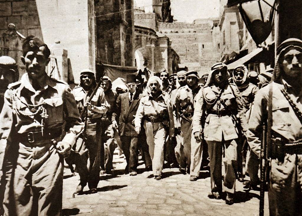 King Abdullah I bin al-Hussein being escorted by members of the Arab Legion in Jerusalem, 1899