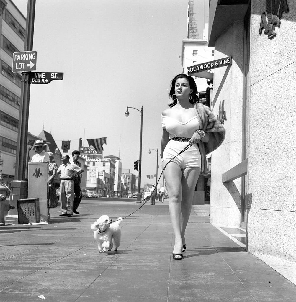 Joan Bradshaw Walking on Hollywood Boulevard with her dog, 1957