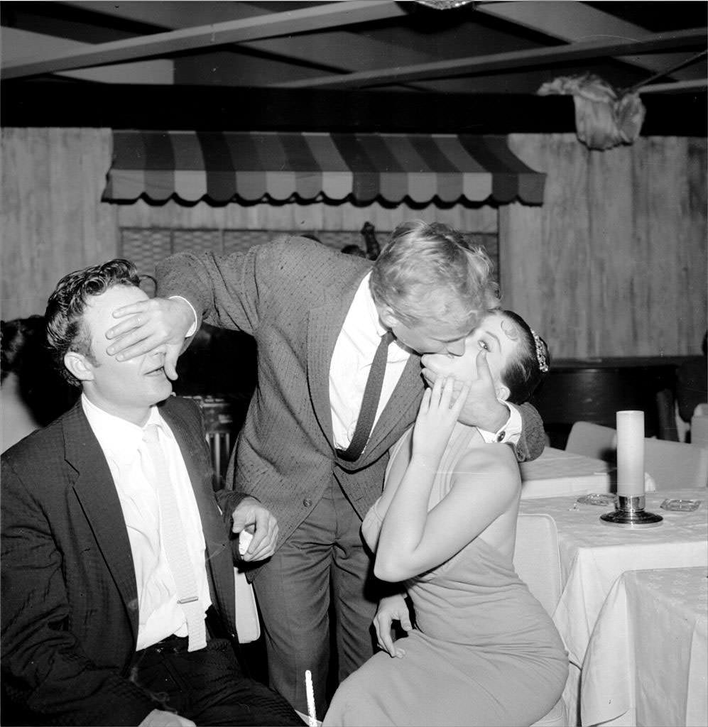 A man kissing Joan Bradshaw, 1960