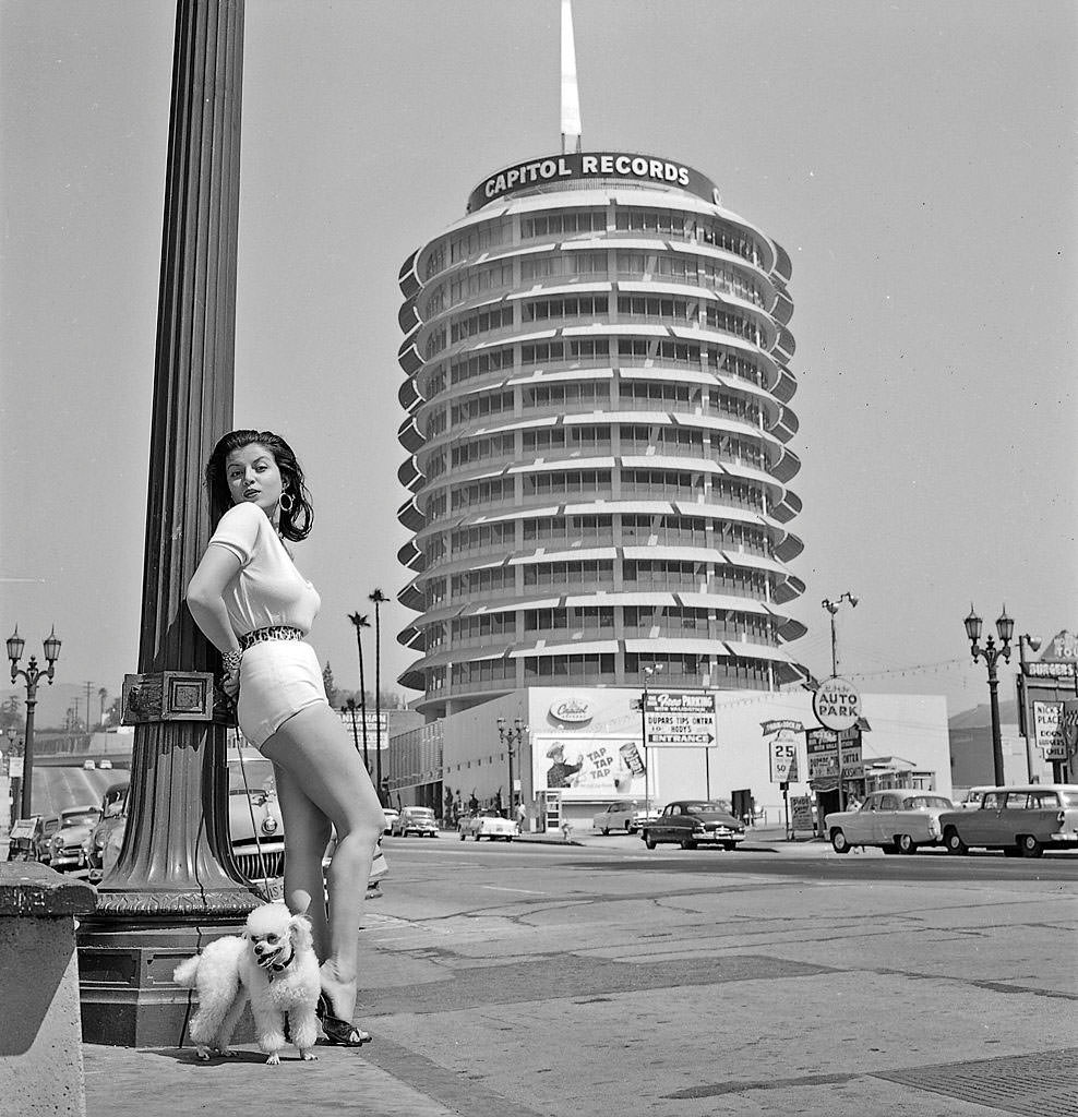 Joan Bradshaw poses by the Capitol Records building on September 8, 1957