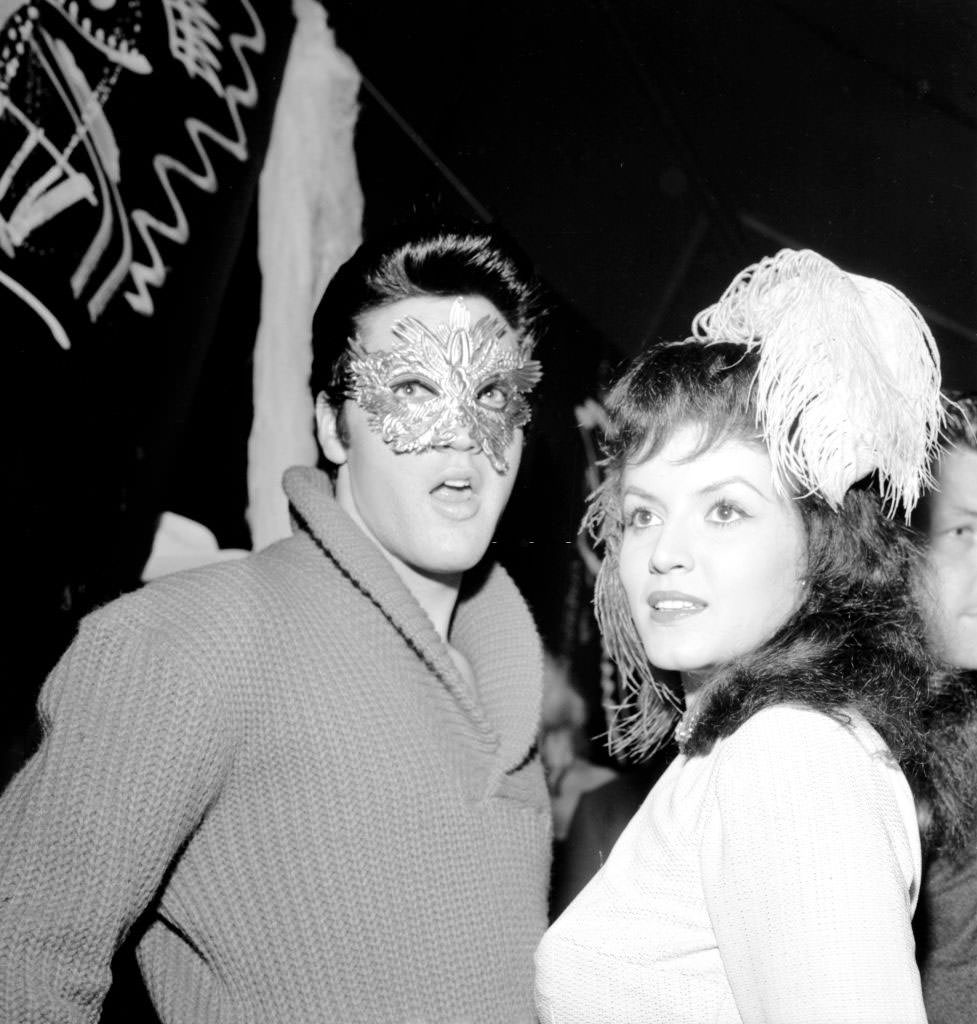 Joan Bradshaw with Elvis Presley in a Halloween party, October 31, 1957