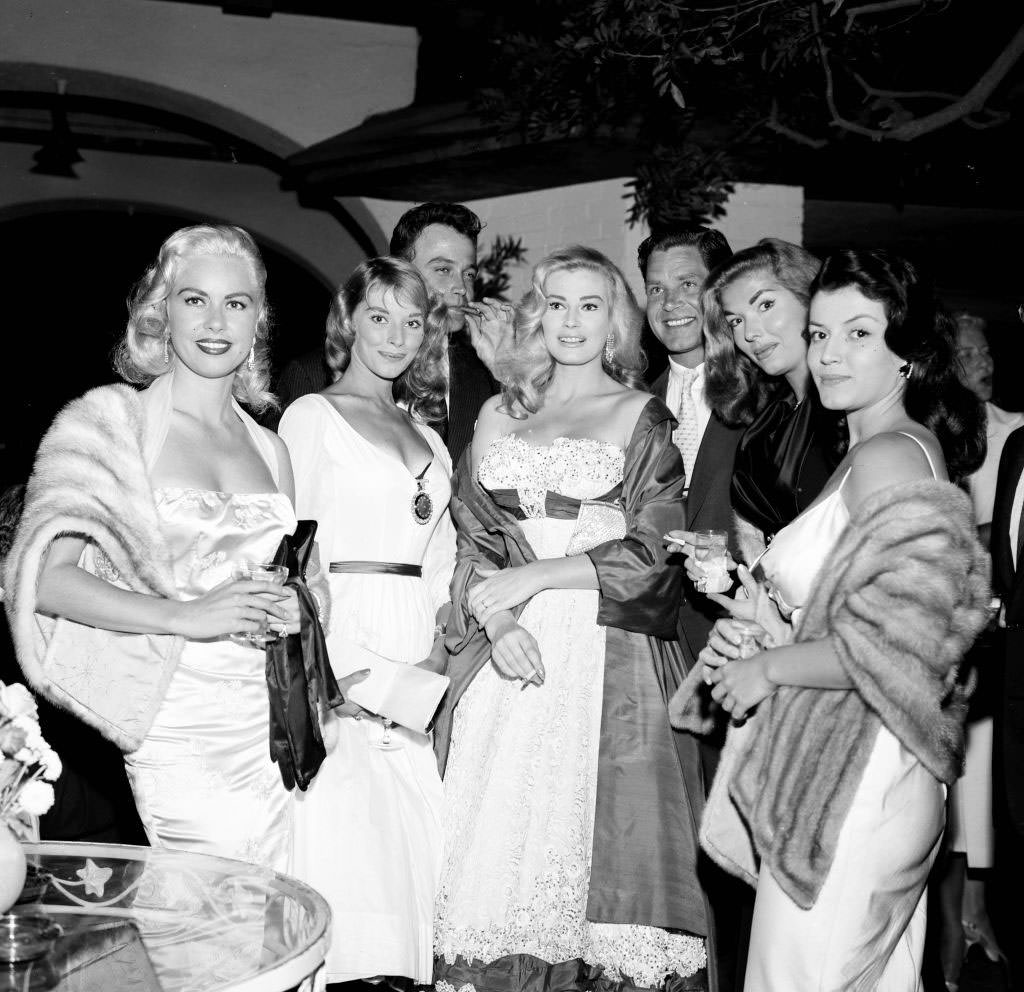 Joan Bradshaw with Jeanne Carmen, Vikkie Dugan, Lance Fuller, Anita Ekberg, Anthony Steel and Joan Tyler at a party, 1957