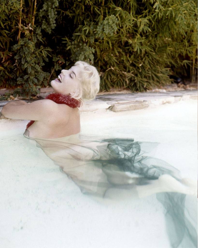 June Wilkinson during a photo shoot in a pool, circa 1960