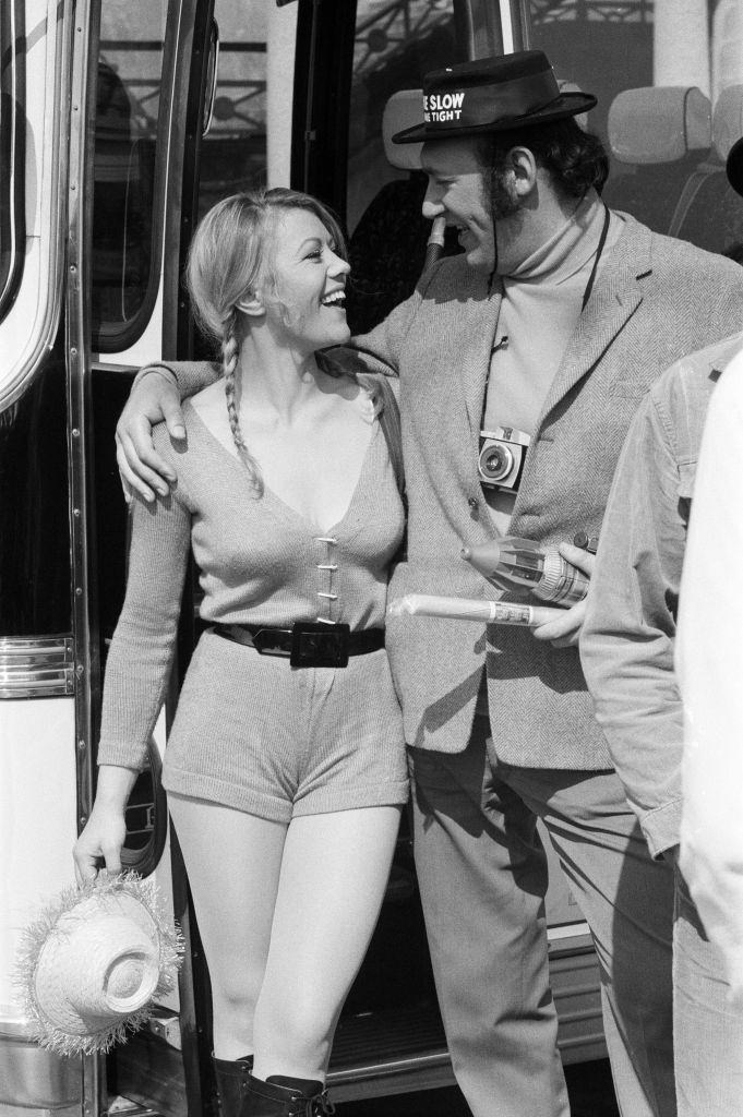 Margaret Nolan with Bernard Bresslaw, during the filming of 'Carry On', 1971