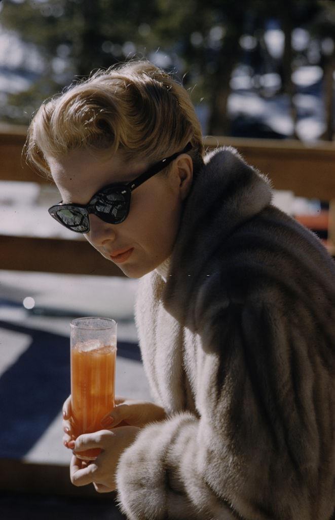 Martha Hyer enjoying a drink in her Beverly Hills house, 1959