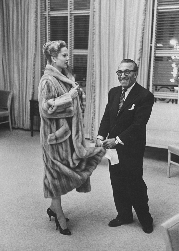 Martha Hyer discussing altering one of her mink coats with a furrier