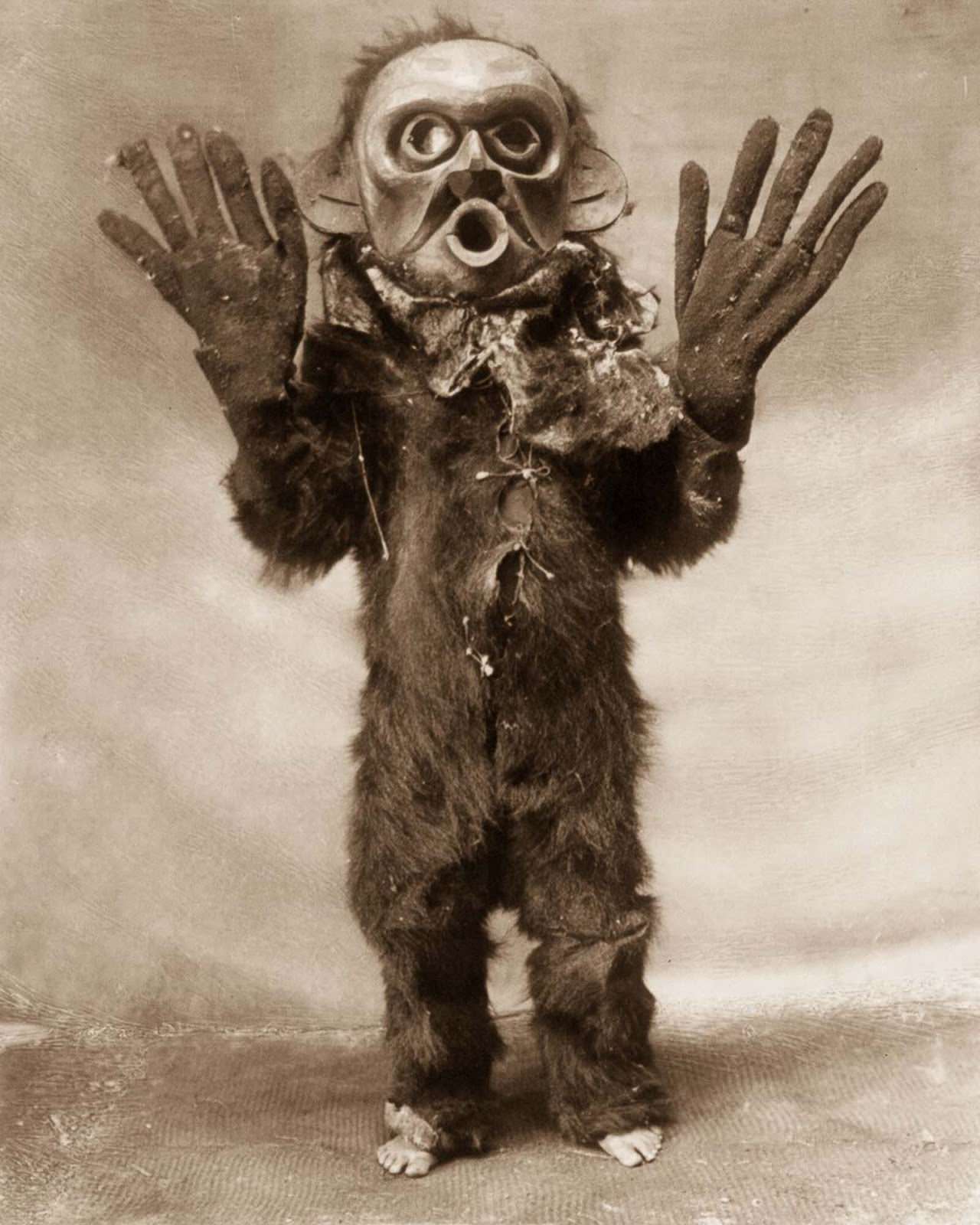 A Koskimo man dressed as Hami (“dangerous thing”) during a Numhlim ceremony. 1914.