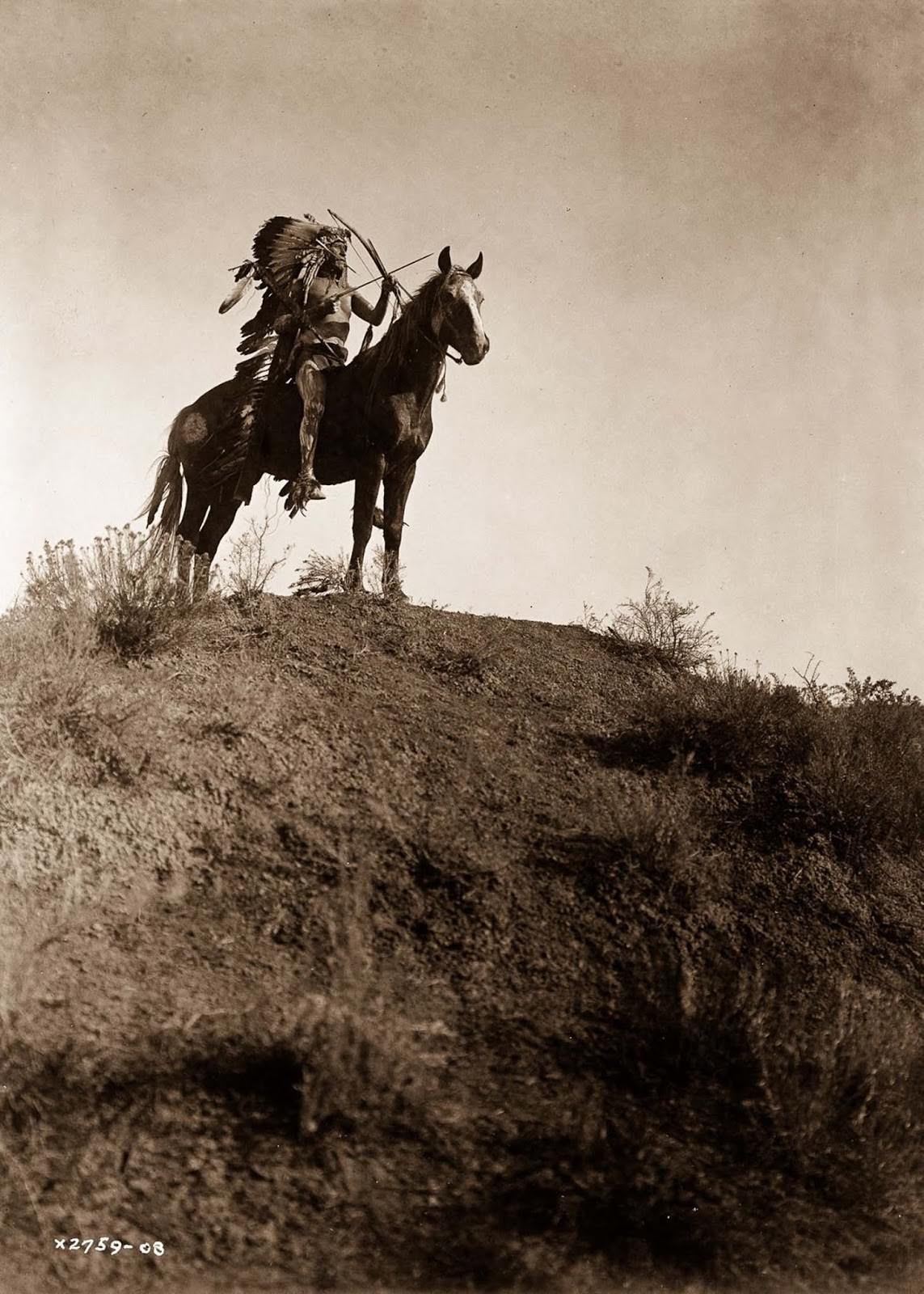 An Apsaroke man on horseback. 1908.