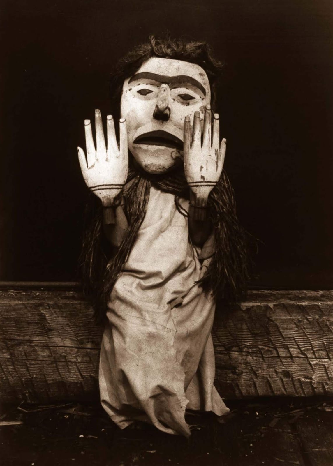 A Kwakiutl person dressed as a forest spirit, Nuhlimkilaka, (“bringer of confusion”). 1914.