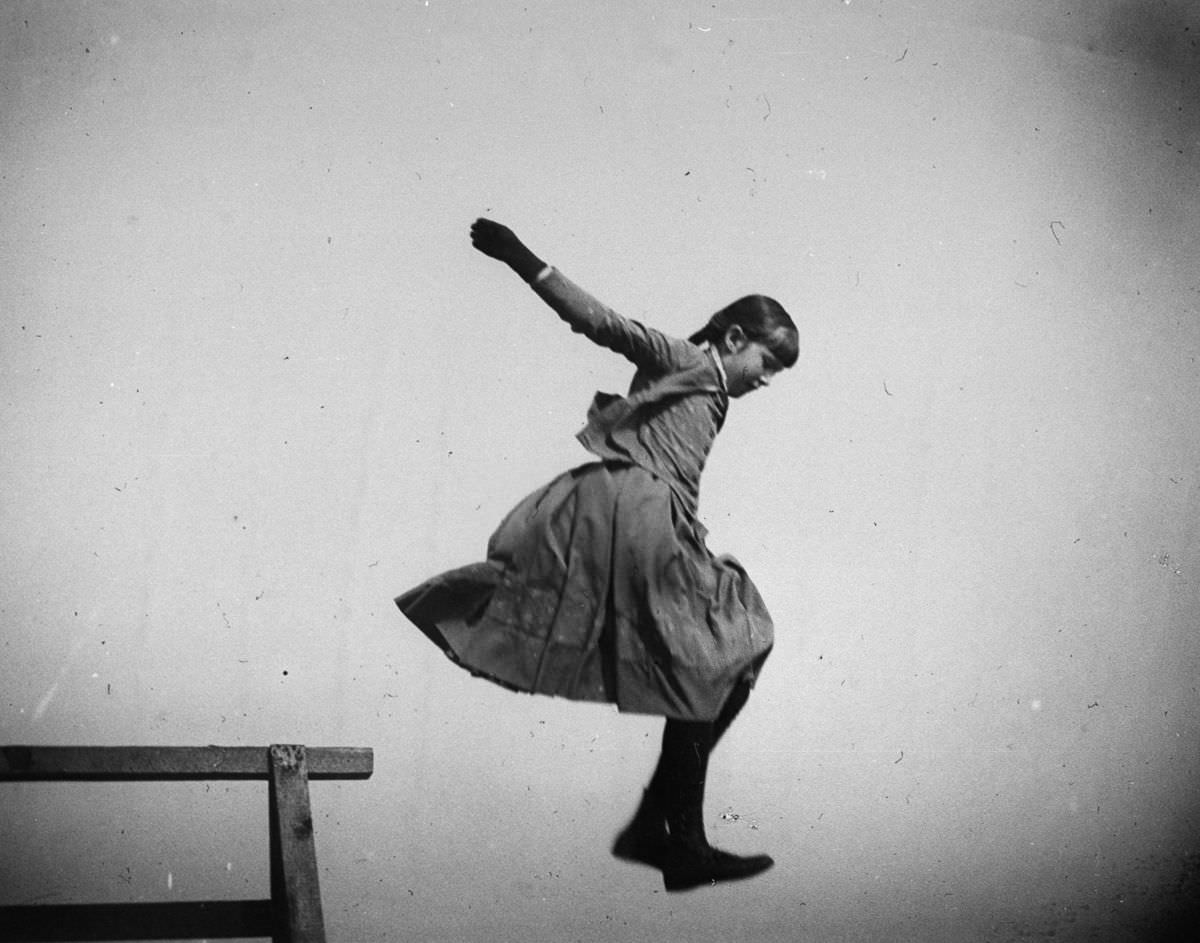 Ethel Merritt jumps in the air at Coney Island.June 11, 1886