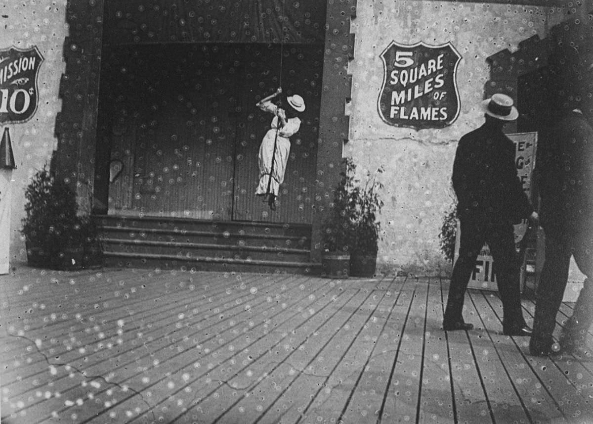 A woman swings on a rope at Coney Island.c. 1890